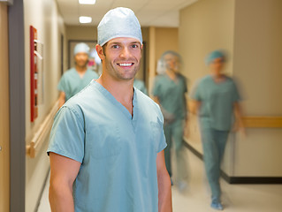 Image showing Happy Doctor With Team At Hospital Corridor