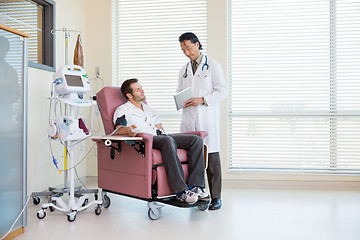 Image showing Doctor Showing Digital Tablet To Patient In Chemo Room