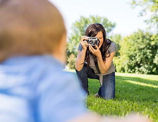 Image showing Woman Photographing Baby Son