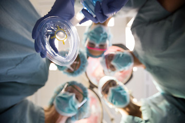 Image showing Multiethnic Doctors With Oxygen Mask In Operation Room