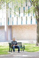 Image showing University Student Sitting On Bench At Campus