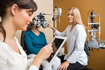 Image showing Eye Doctors Examining Senior Woman In Store