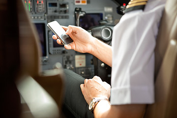 Image showing Pilot Using Cell Phone In Cockpit