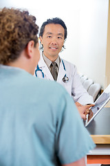 Image showing Doctor And Nurse Using Digital Tablet At Reception