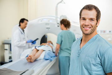 Image showing Nurse With Colleague And Doctor Preparing Patient For CT Scan