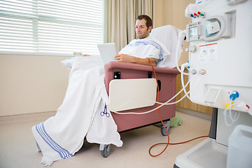 Image showing Patient Using Tablet Computer Waiting for Dialysis Treatment