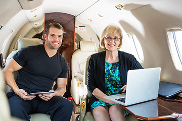 Image showing Confident Business People On Private Jet