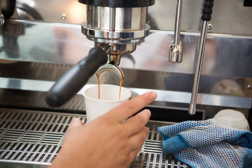 Image showing Barista Making Coffee In Cafeteria