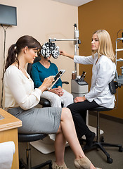 Image showing Optometrists Examining Patient At Store