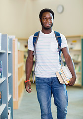 Image showing Student With Books Looking Away In Library