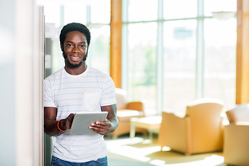 Image showing Student With Digital Tablet Standing In Library