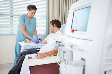 Image showing Nurse Injecting Patient For Renal Dialysis Treatment