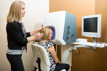 Image showing Optometrist With Patient Looking At Computer For Retinal Checkup