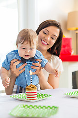 Image showing Mother With Baby Boy Celebrating Birthday At Home