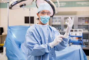 Image showing Surgeon Wearing Gloves In Operation Room