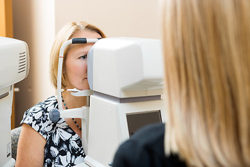 Image showing Optometrist Using Tonometer to Measure Patients Eye Pressure