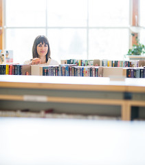 Image showing Student Choosing Book In Bookstore