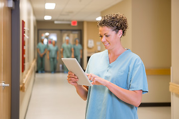 Image showing Doctor Using Digital Tablet In Hospital Corridor