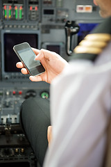 Image showing Pilots Using Smartphone In Cockpit