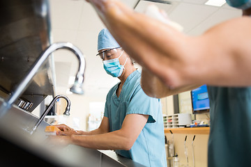 Image showing Surgeons Scurbbing Hands and Arms