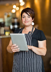 Image showing Beautiful Owner Holding Digital Tablet In Cafeteria