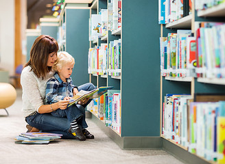 Image showing Student With Teacher Reading Book In Library