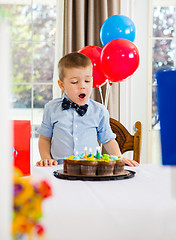 Image showing Boy With Mouth Open Looking At Cake