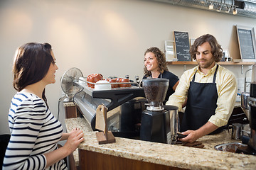 Image showing Customer Looking At Baristas Making Coffee In Cafeteria