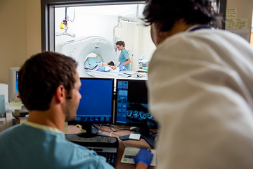 Image showing Medical Team Operating Computers In CT Scan Lab