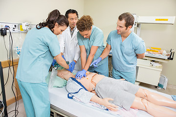 Image showing Medical Team Performing CPR On Dummy Patient