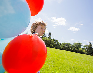 Image showing Boy With Balloons In Park
