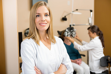 Image showing Eye Specialist With Colleague Examining Patient