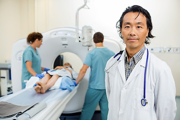 Image showing Radiologist With Nurses Preparing Patient For CT Scan Test