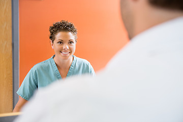 Image showing Nurse Looking At Patient In Hospital