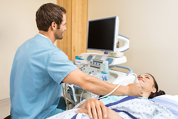 Image showing Male Nurse Performing Ultrasound On Patient's Neck