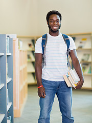 Image showing Student With Books Standing In Bookstore