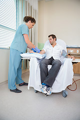 Image showing Nurse Starting Dialysis Machine