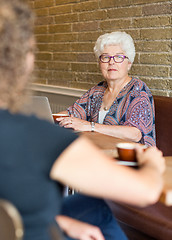 Image showing Senior Woman With Friend In Coffeeshop