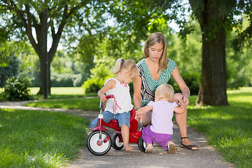 Image showing Mother And Children With Tricycle In Park