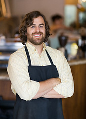 Image showing Male Owner Standing Arms Crossed In Cafeteria