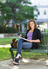 Image showing Confident Student Studying On Bench At Campus