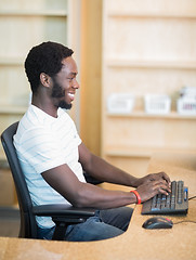 Image showing Librarian Working On Computer At Library Desk