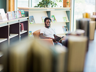 Image showing Student Reading Book In Library