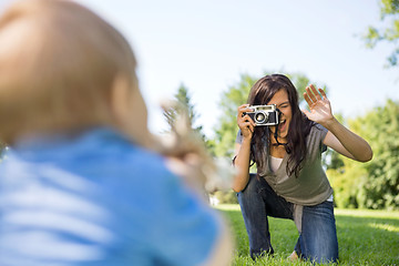 Image showing Mother Photographing Son Through Camera