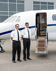 Image showing Pilots Standing By Private Jet