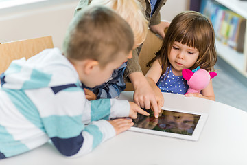 Image showing Children Using Digital Tablet In School Library