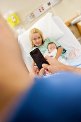 Image showing Man Photographing Woman And Babygirl Through Mobile Phone