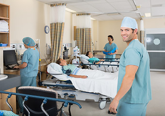 Image showing Male Nurse Standing In Hospital PAR unit