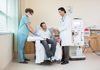 Image showing Doctor Showing Digital Chart to Dialysis Patient