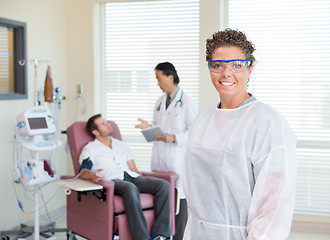 Image showing Nurse With Doctor Examining Patient's Heartbeat In Hospital